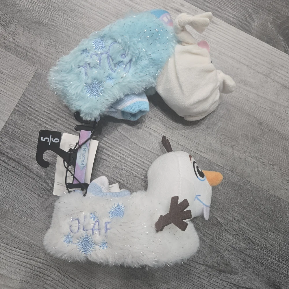 Disney Frozen toddler girls' sock top slippers feature mismatched Elsa and Olaf